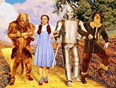 Dorothy and cast walking the yellow brick road