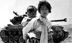 Korean children in front of tank